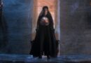 Morpheus the Endless Lord of the Dreaming, standing in black robes while holding a talisman