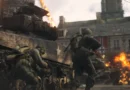 Imagem promocional do jogo Call of Duty: WWII mostrando ação militar intensa, com ênfase em cenário da Segunda Guerra mundial, destacando personagem principal, bandeira dos Estados Unidos e ambiente de combate.