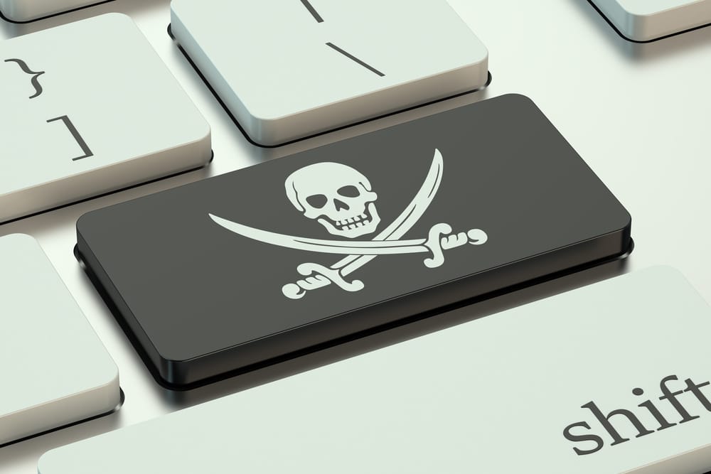 Operação 404 derruba 535 sites e aplicativo pirata 5 Botão de teclado com desenho de caveira, simbolizando pirataria digital